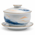 Handbemalte Porzellan-Teetasse mit Untertasse in Blau und Gold