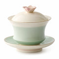 Teetasse mit Blüten-Deckel und Untertasse, grün