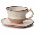 Handgefertigte Keramiktasse mit Unterteller in Rosa und Beige